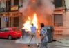 Queman varios contenedores frente la sede central de Vox