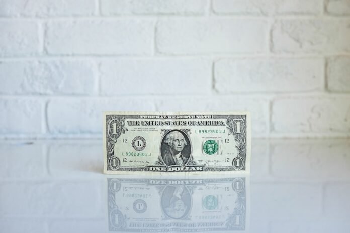 1 U.S. dollar banknote on white surface