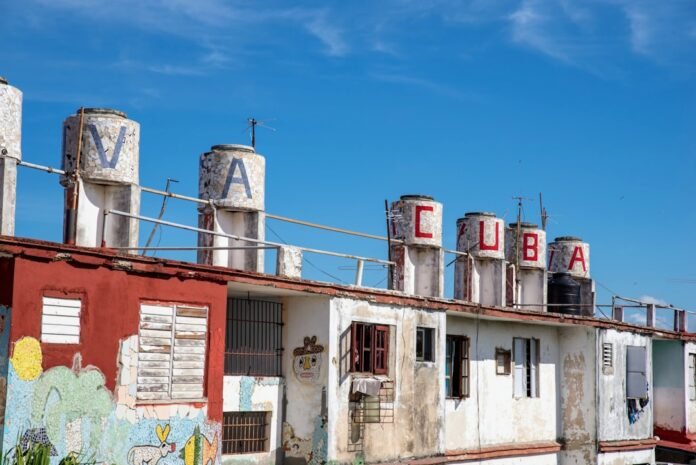 white and red concrete building under blue sky during daytime