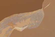 La revolución del grafeno bicapa: cómo un ángulo microscópico está transformando la física cuántica a close-up of a yellow and white substance