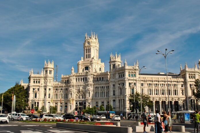 a large white building with a clock tower