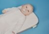 El Polémico Legado de Infantino: Cómo la FIFA Estrechó Lazos con Estados Unidos baby in white onesie lying on bed
