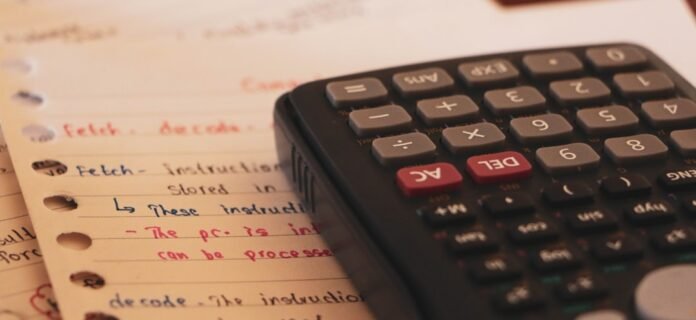 a calculator sitting on top of a piece of paper