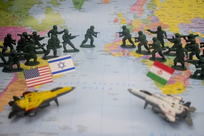 Toy soldiers and flags on world map
