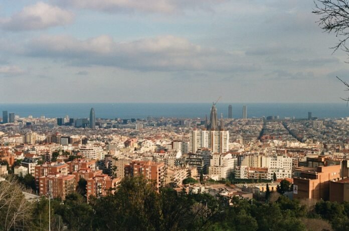 Panoramic cityscape with buildings and the ocean in background
