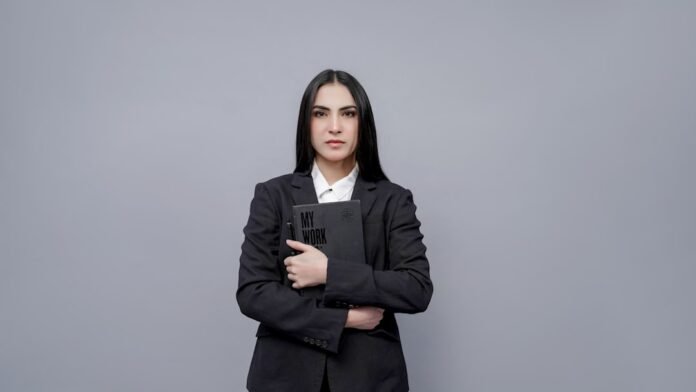 image_1774112426584 a person holding a laptop