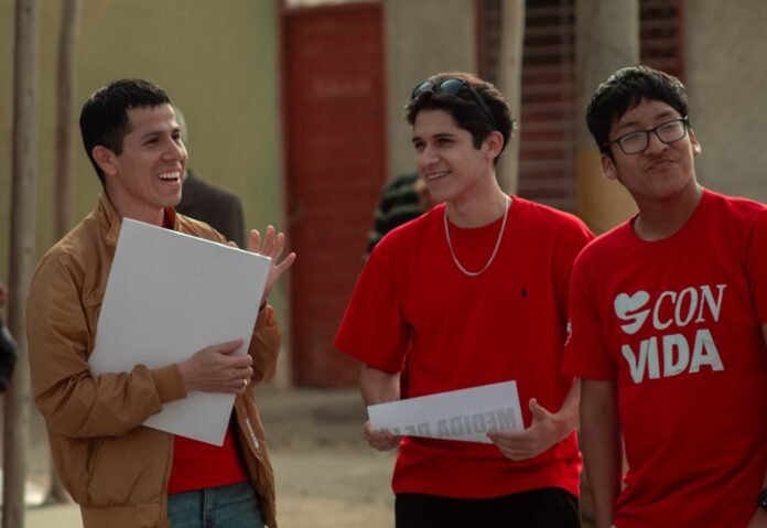 A group of people standing next to each other