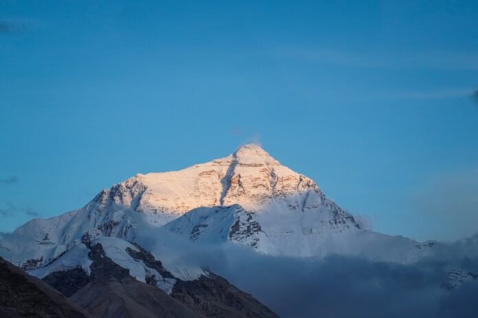 image_1775253629234 Snowy mountain peak lit by the sun.