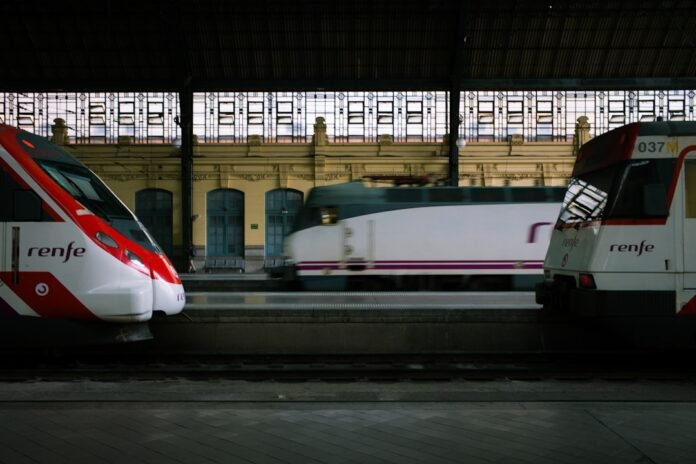 image_1775296829909 white and red Renfe train station
