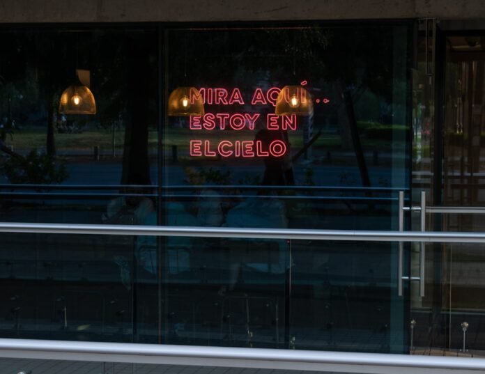 image_1775512827664 a neon sign in the window of a restaurant