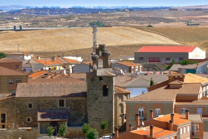 a view of a town with a clock tower