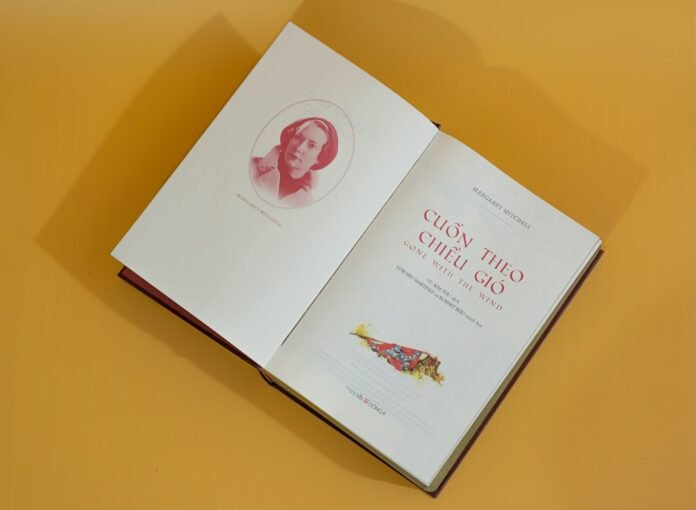 an open book with a picture of a woman