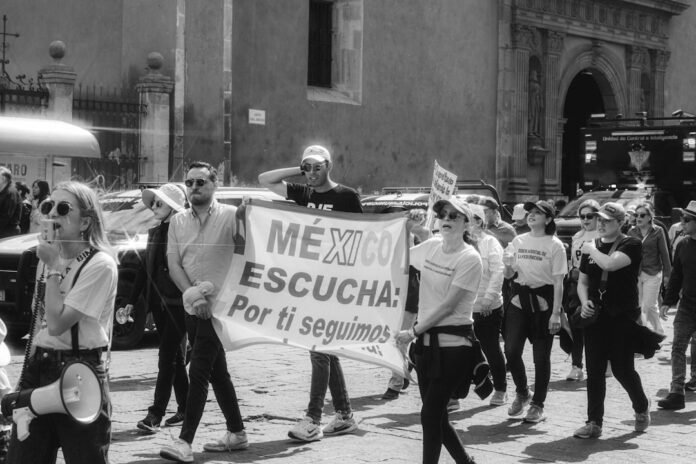 A group of people marching down a street