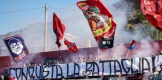 La batalla regulatoria por los alquileres: entre la presión gubernamental y la resistencia del sector inmobiliario Fans wave flags and banners at a sporting event.