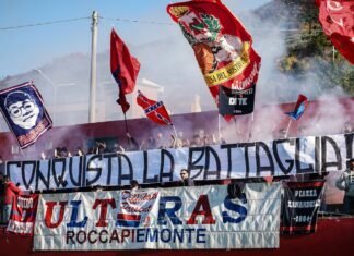 La batalla regulatoria por los alquileres: entre la presión gubernamental y la resistencia del sector inmobiliario Fans wave flags and banners at a sporting event.