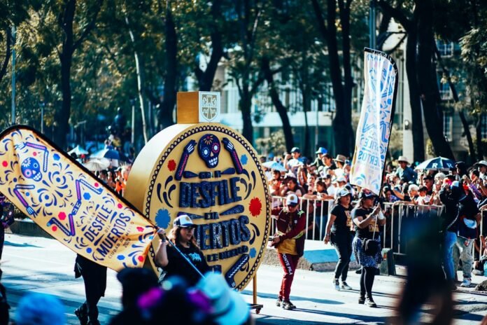 a group of people walking down a street holding a sign