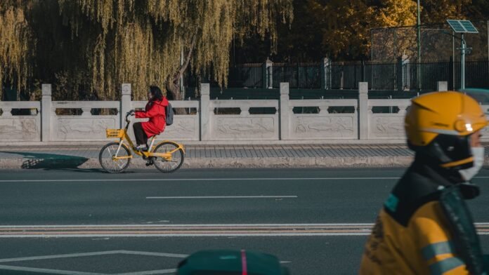 A person riding a bike on a city street