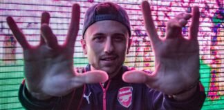 Arsenal vs Atlético de Madrid: Todo lo que necesitas saber sobre la vuelta de semifinales de Champions League man wearing black and red Puma zip-up jacket