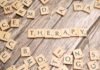 La esperanza terapéutica llega a los pacientes con epidermólisis bullosa: una nueva era en el tratamiento de la piel de mariposa scrabbled scrabble tiles spelling the word therapy