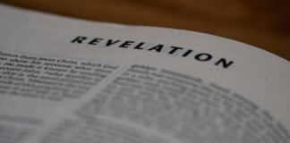 Ram V y Anand RK Reviven a Resurrection Man en una Nueva Era Cuántica del Cómic A bible page showing the book of revelation.