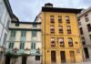 El desafío del Real Oviedo: Cuando David se enfrenta a Goliat en La Cartuja Colorful old buildings with flowers on balconies.