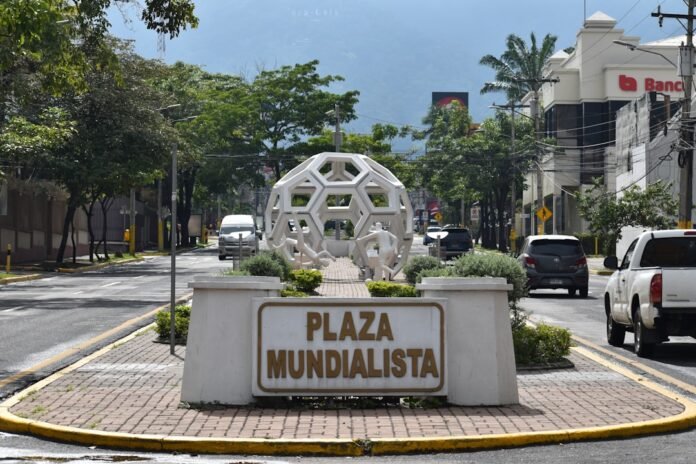 a large white sculpture in a city