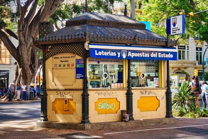A bus stop sitting on the side of a road