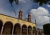 Corrupción consular: España enfrenta una crisis sistémica en la emisión de visados en el norte de África a building with arches and a clock tower