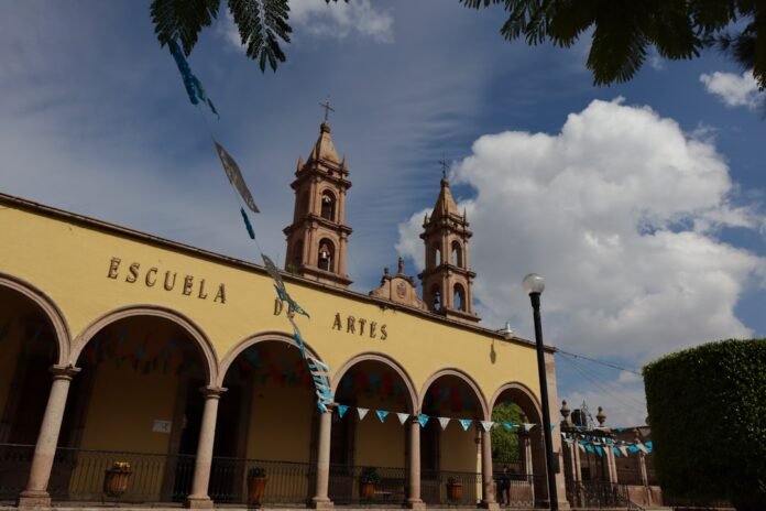 a building with arches and a clock tower