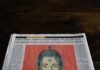 España logra gestión diplomática exitosa tras detención de activista en territorio israelí a newspaper with a picture of a woman on it