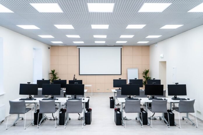 a room filled with lots of desks and computers