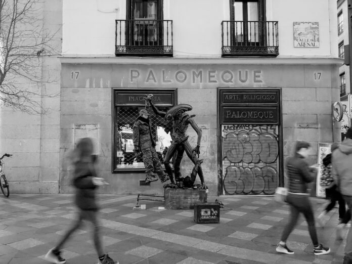 grayscale photography of Palomeque building