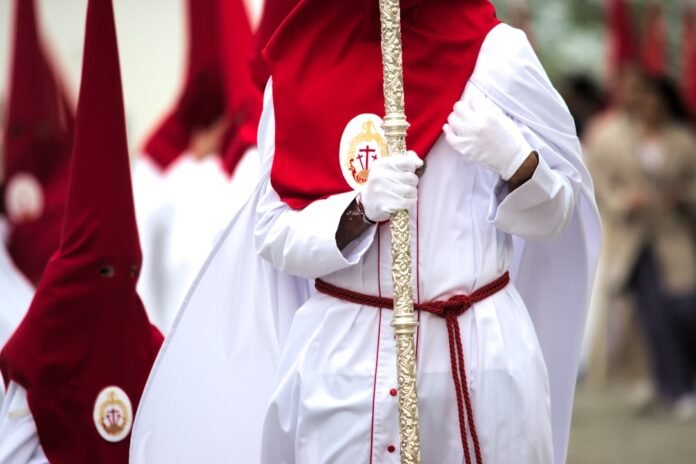 a group of people dressed in white and red