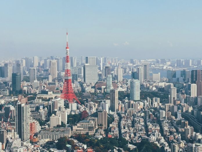 image_1783656036731 red and white tower in the city during daytime