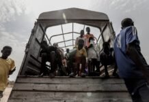 Menores Migrantes No Acompañados: El Gran Reto del Sistema de Acogida Español y los 35 Millones en Juego people in a white boat during daytime