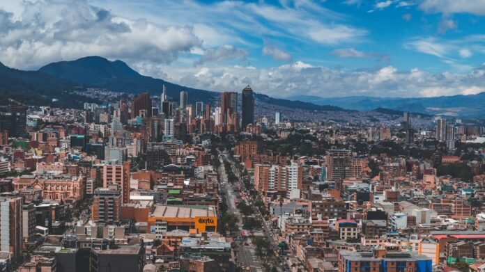 a city with mountains in the background