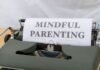 Permiso Parental y Productividad Empresarial: Por Qué las Empresas Españolas Están Cambiando de Mentalidad a close up of a typewriter with a sign on it