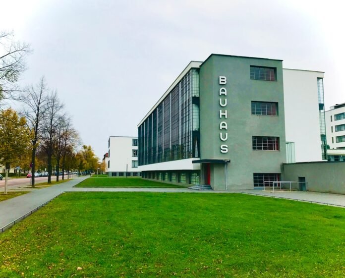 a building with a green lawn