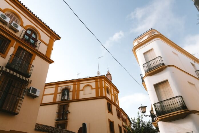 Buildings with architectural details against a blue sky