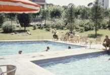 Renovación histórica de la piscina cubierta de Bellavista: Sevilla apuesta por la modernización de sus instalaciones deportivas man wearing black brief sitting beside on pool
