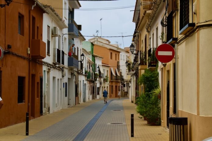 image_1787436040283 a person walking down a street