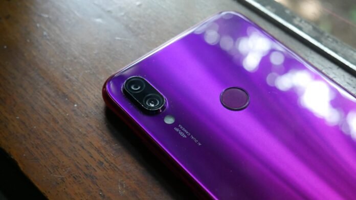 Purple smartphone with dual camera and fingerprint sensor