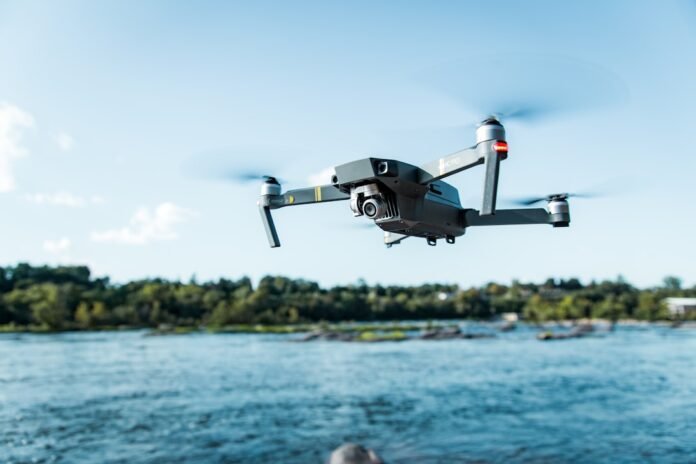 image_1788008436825 black DJI Mavi quadcopter near body of water