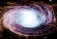 Fronteras del Cosmos y la Mente: De Magnetares a Pollitos, la Ciencia que Redefine Nuestra Comprensión del Universo A vibrant, swirling galaxy with a bright center