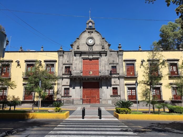 a large building with a clock on the top of it