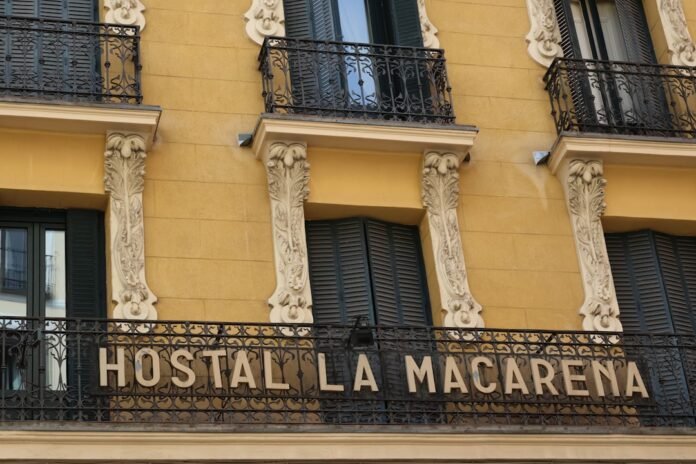 a yellow building with a sign that says hotel amaarena
