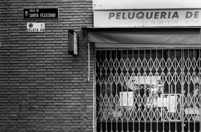 grayscale photo of metal gate