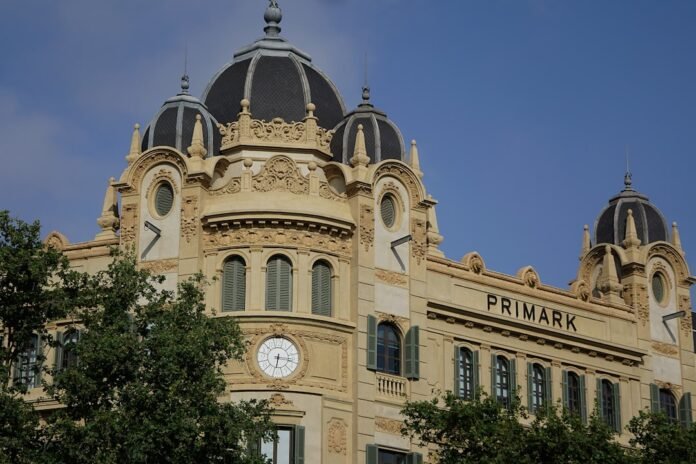Ornate building with primark sign under blue sky