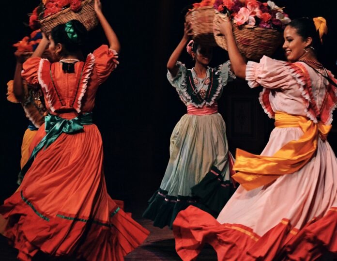 women in green and brown dress dancing