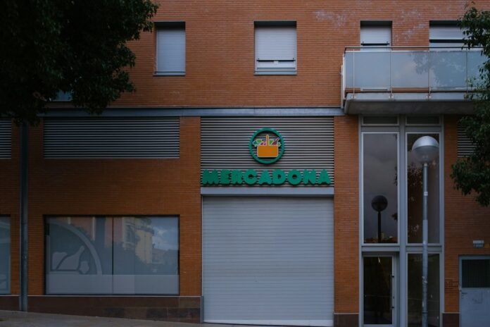 Mercadona supermarket storefront with orange brick building